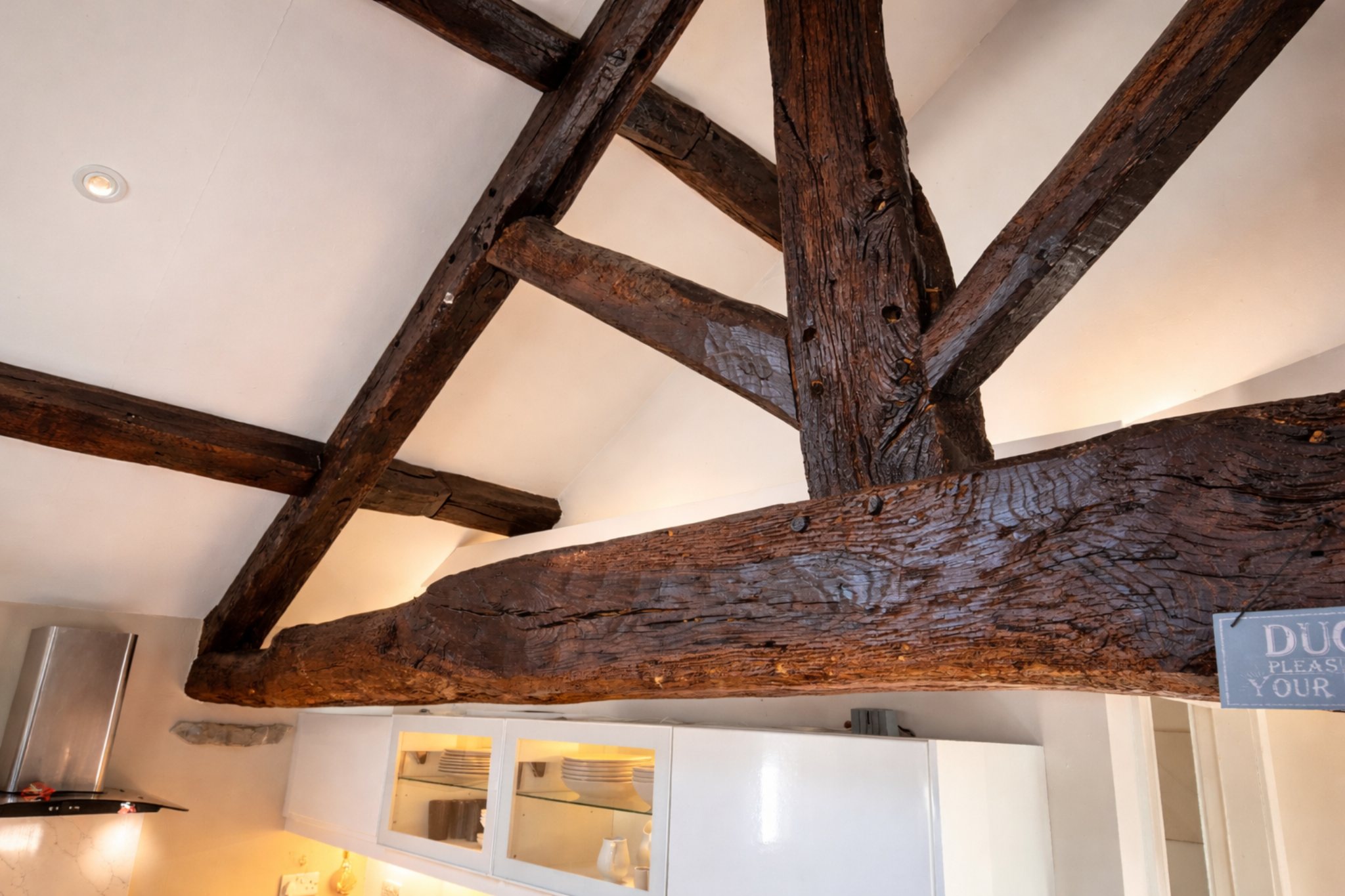 Rustic oak beams above the kitchen